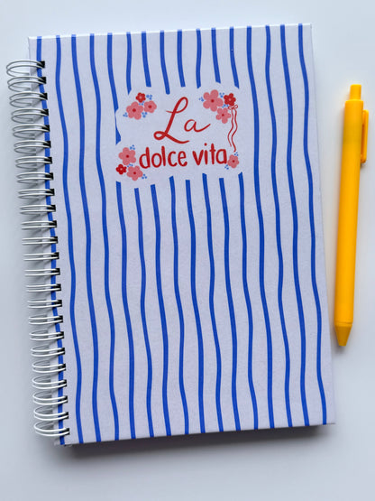 Blue Italian inspired lined notebook with white spiral coils. 